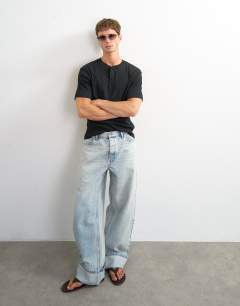 Model wearing Slim fit rib henley t-shirt in black