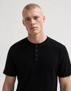 Model wearing Slim fit rib henley t-shirt in black