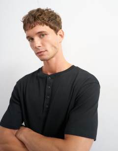Model wearing Slim fit rib henley t-shirt in black