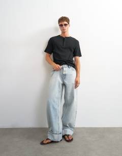 Model wearing Slim fit rib henley t-shirt in black