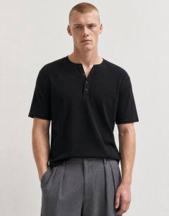 Model wearing Slim fit rib henley t-shirt in black