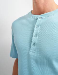 Model wearing Slim fit rib henley t-shirt in light blue
