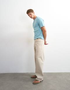 Model wearing Slim fit rib henley t-shirt in light blue