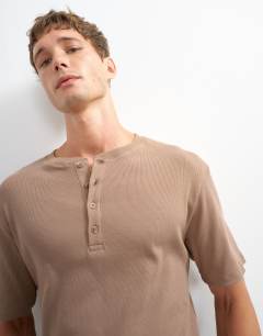 Model wearing Slim fit rib henley t-shirt in light brown