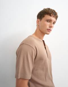 Model wearing Slim fit rib henley t-shirt in light brown