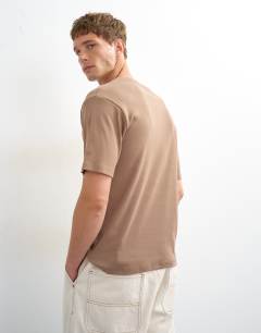 Model wearing Slim fit rib henley t-shirt in light brown