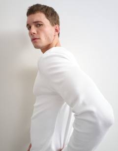Model wearing Slim fit rib long sleeve t-shirt in white