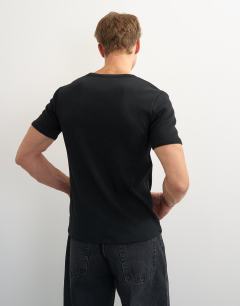 Model wearing Slim fit rib t-shirt in black