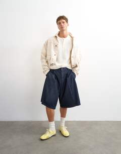 Model wearing Slim fit short sleeve waffle henley in ecru