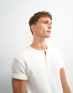 Model wearing Slim fit short sleeve waffle henley in ecru