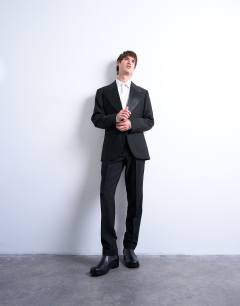 Model wearing Slim tux suit trousers in black