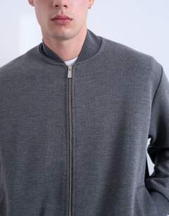 Model wearing Smart knitted bomber jacket in grey