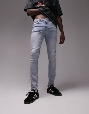 super skinny light blue ripped jeans mens