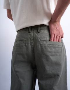 Model wearing Straight fit herringbone trouser in khaki