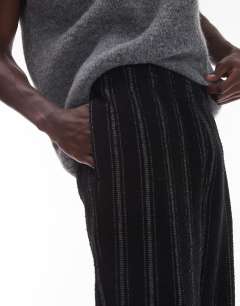 Model wearing Straight fit jogger with textured stripe in black