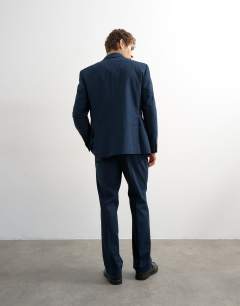 Model wearing Straight fit linen blend trousers in navy