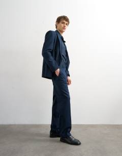Model wearing Straight fit linen blend trousers in navy