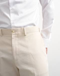 Model wearing Straight fit linen blend trousers in stone