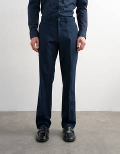 Model wearing Straight fit linen rich trousers in navy