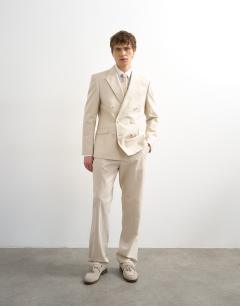 Model wearing Straight fit linen rich trousers in stone