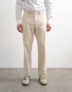 Model wearing Straight fit linen rich trousers in stone