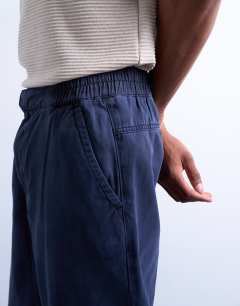 Model wearing Straight leg twill elasticated waist trouser in navy