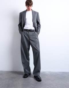Model wearing Straight suit trouser in charcoal pinstripe