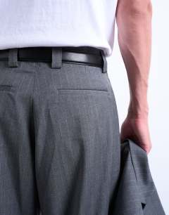 Model wearing Straight suit trouser in charcoal pinstripe