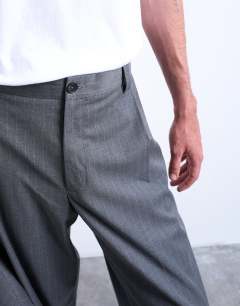 Model wearing Straight suit trouser in charcoal pinstripe