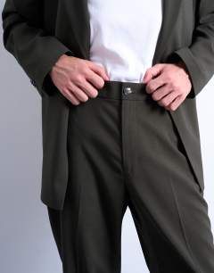 Model wearing Straight wool touch suit trousers in green