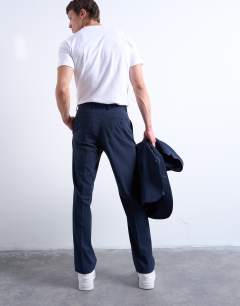 Model wearing Straight wool touch suit trousers in navy