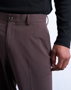 Model wearing Straight wool touch trousers in chocolate