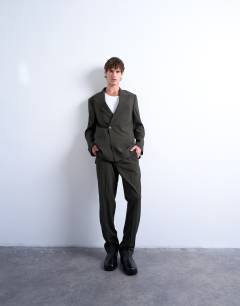 Model wearing Straight  wool touch trousers in dark green