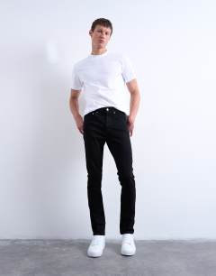 Model wearing Stretch skinny jean in black