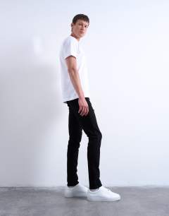 Model wearing Stretch skinny jean in black