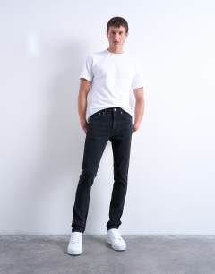 Model wearing Stretch skinny jean in washed black