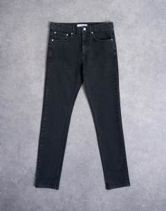 Model wearing Stretch skinny jean in washed black