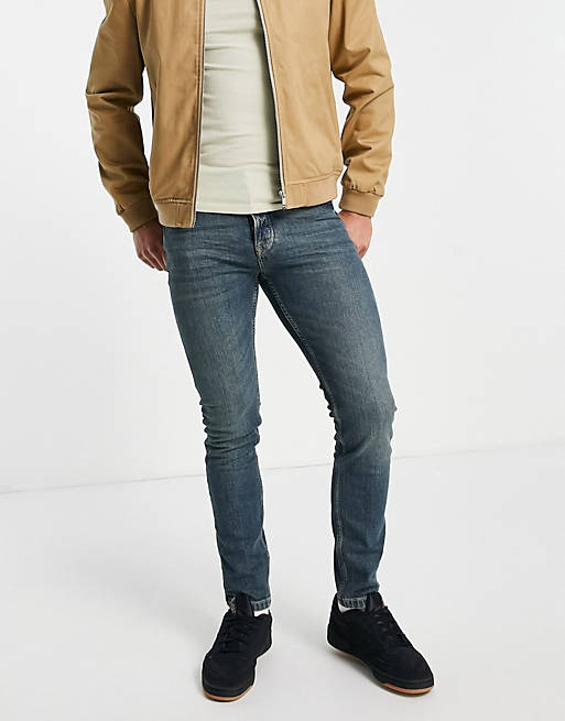 Stretch skinny jeans in green cast mid wash tint ASOS Herren Kleidung Hosen & Jeans Jeans Stretch Jeans 
