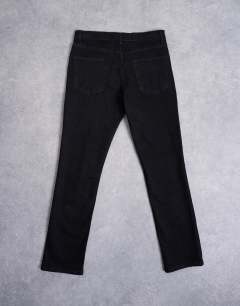 Model wearing Stretch slim jean in black