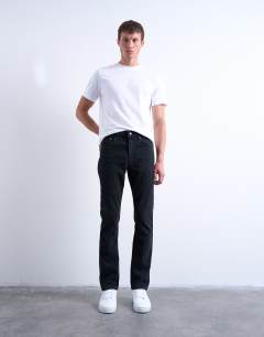 Model wearing Stretch slim jean in washed black