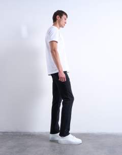 Model wearing Stretch slim jean in washed black