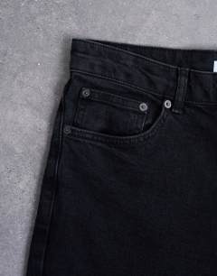Model wearing Stretch slim jean in washed black