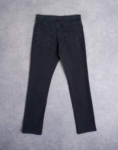 Model wearing Stretch slim jean in washed black