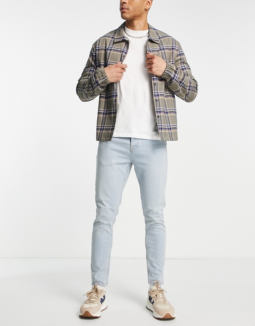 Topman stretch tapered jeans in light wash tint-Blue