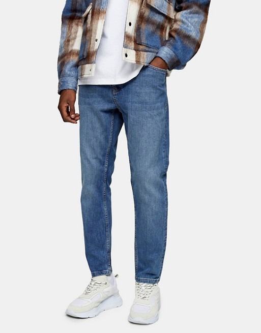 Topman stretch tapered jeans in mid wash