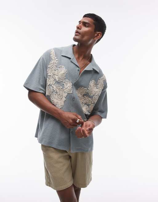 Topman – Szałwiowa dżersejowa koszulka polo oversize z haftowanym wzorem zapinana na guziki