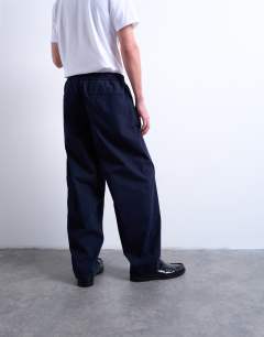 Model wearing Taper fit twill trouser in navy