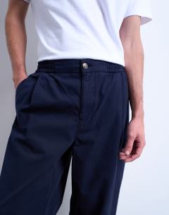 Model wearing Taper fit twill trouser in navy