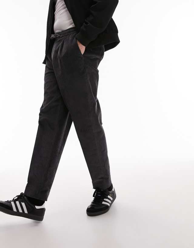 Topman - tapered cord trousers with elasticated waistband in charcoal