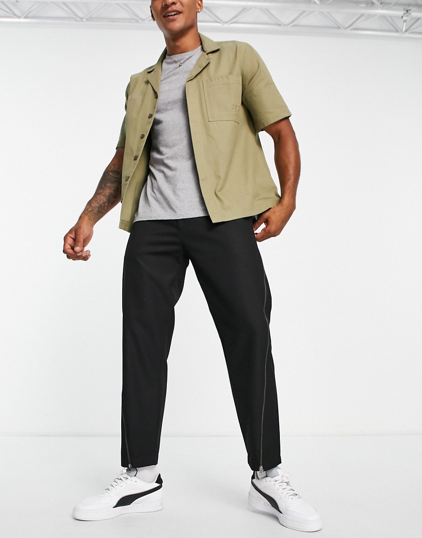 Topman tapered twisted seam trousers with zip detail in black